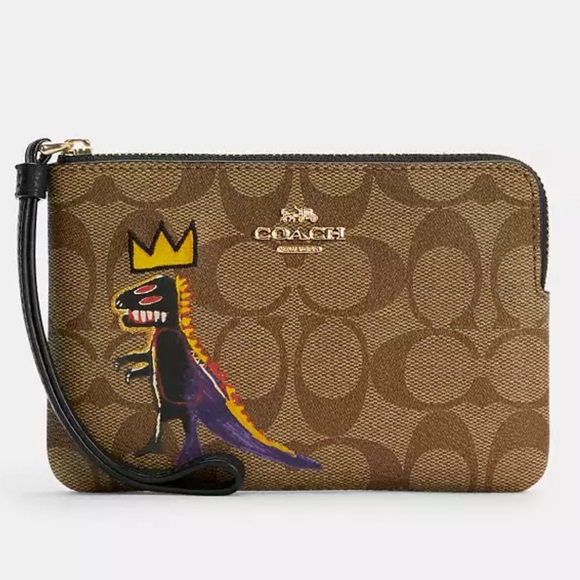 Coach Handbags - NEVER WORN Coach Wristlet with Dinosaur Design